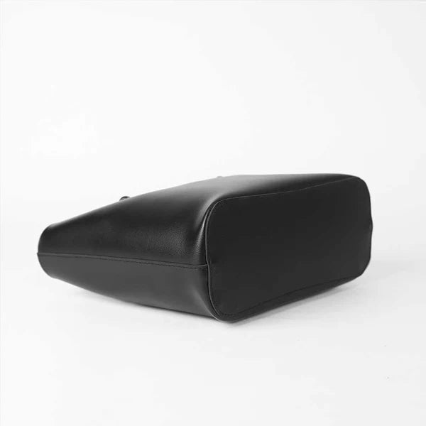 Black tote bag with smooth base, rounded corners and stitched edges