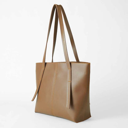 Tan structured tote bag with long handles and contrast stitched seams