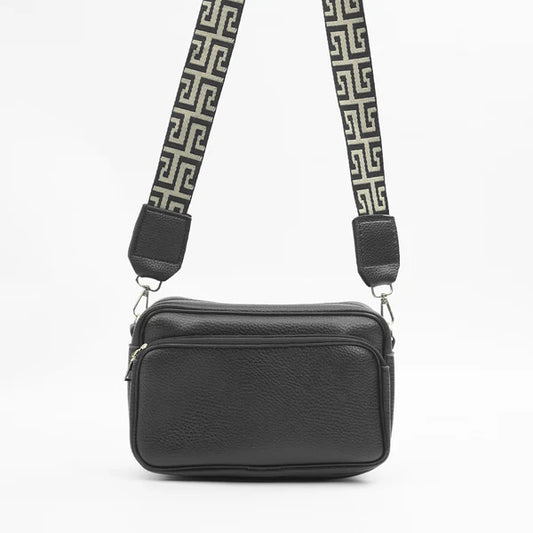 Black shoulder bag with top zip and adjustable Greek-key strap