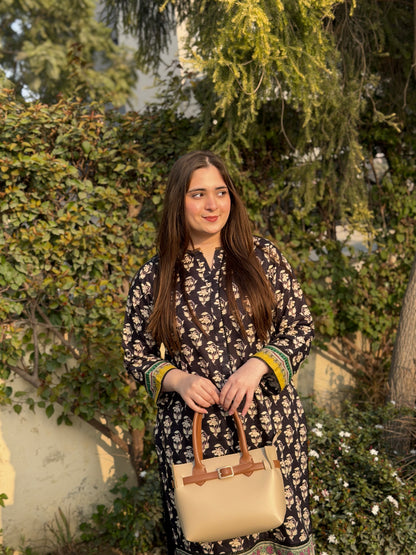 Woman carrying beige tote bag set with buckle strap and front flap pocket