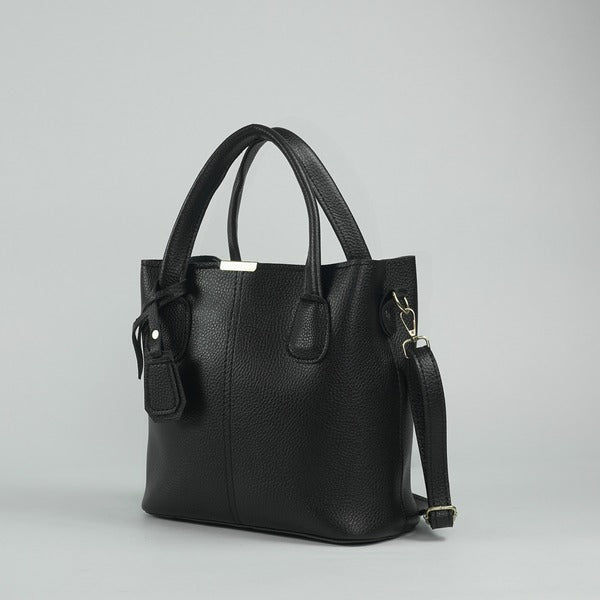 Black leather handbag with side pocket, top handles, and crossbody shoulder strap