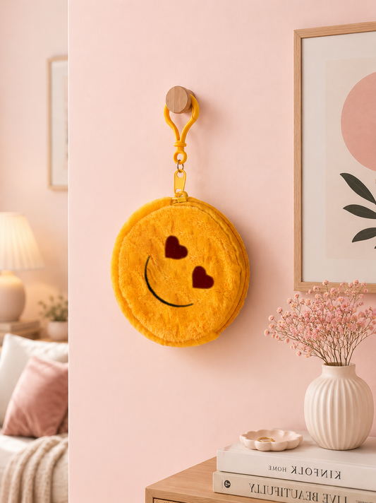 Yellow plush round pouch keychain with heart eyes and smiley face