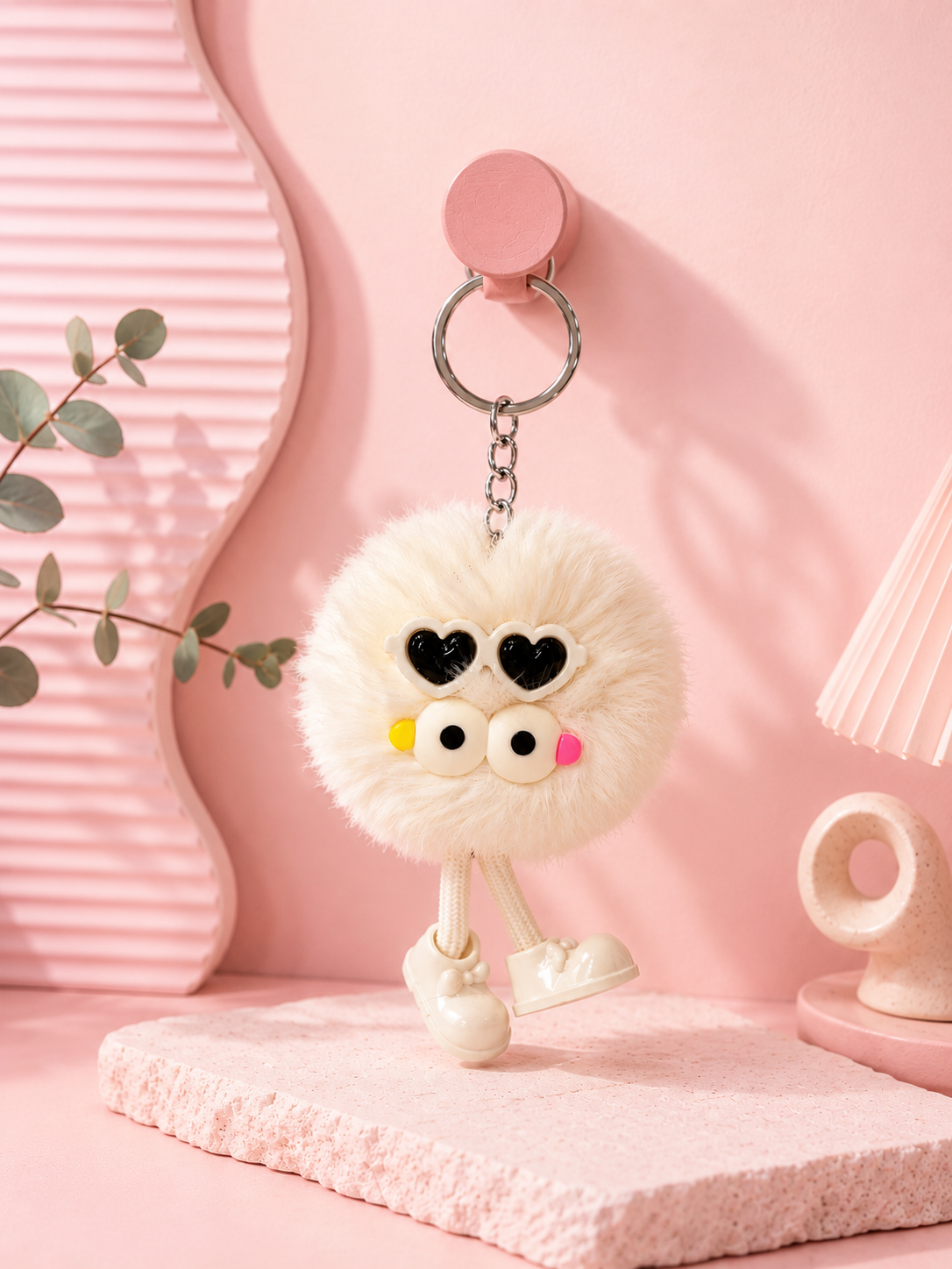 Cream white plush bear keychain with heart-shaped black eyes and pink nose, metal ring