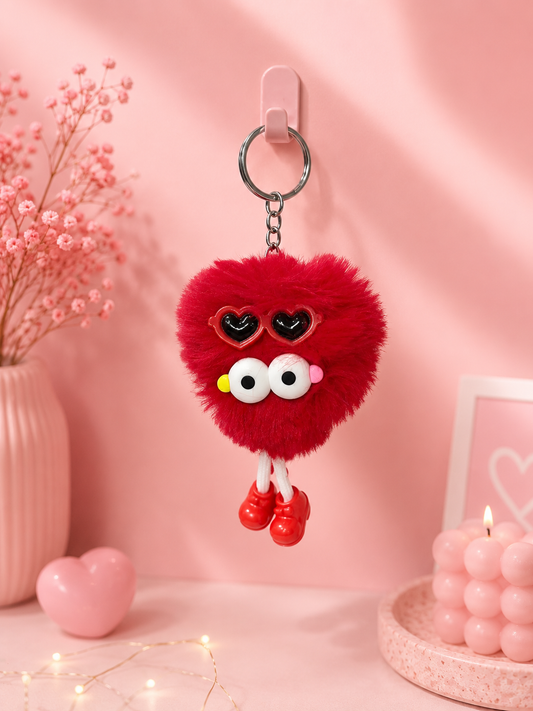 Deep red bear keychain with heart-shaped eye details and metal key ring