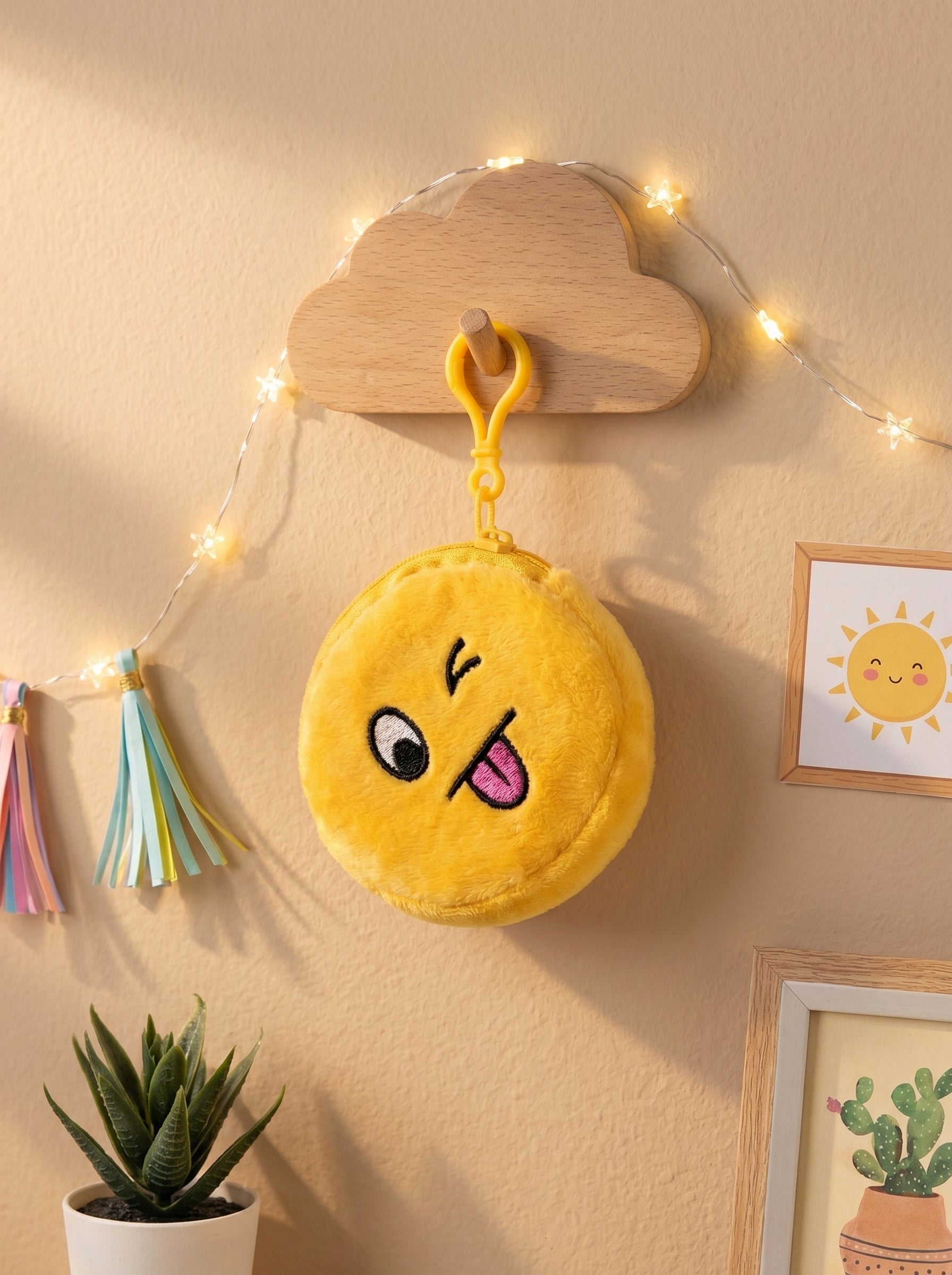 Winking emoji pouch keychain with yellow plush face and wooden cloud hanger