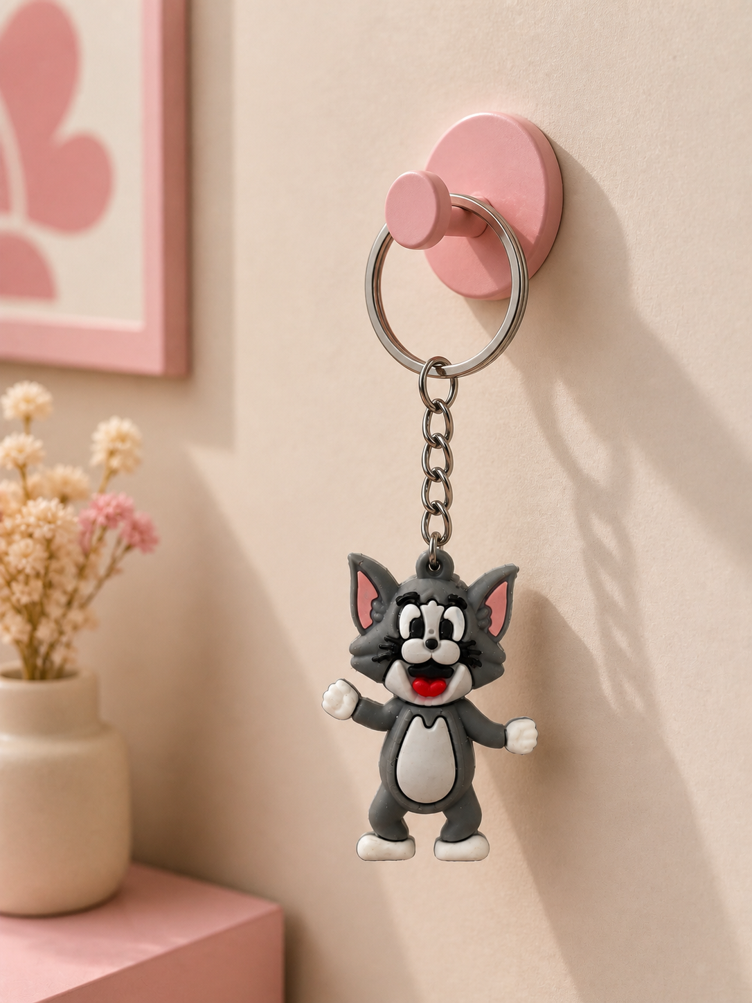 Grey cat keychain with metal ring, chain, and cartoon face charm