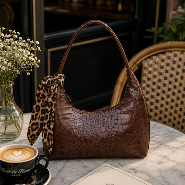 Brown croc-embossed shoulder bag with top handles and leopard-print strap pouch