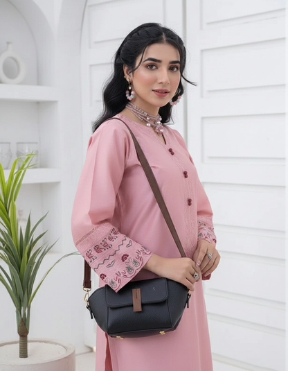 Dark small crossbody handbag with front flap and detachable shoulder strap